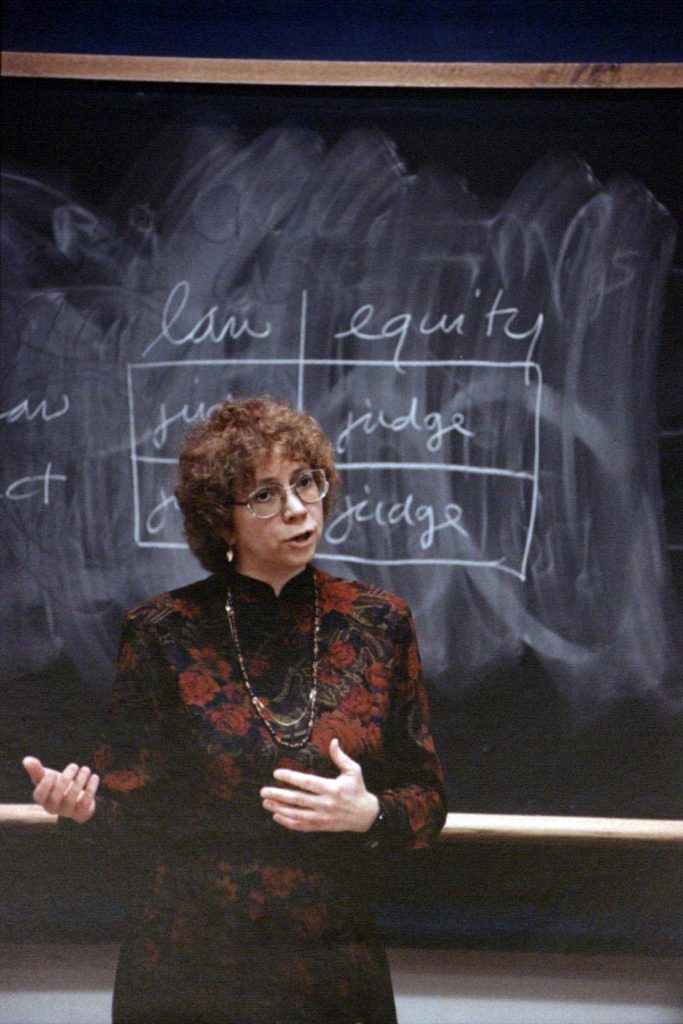 Prof. Sward in front of a chalk board