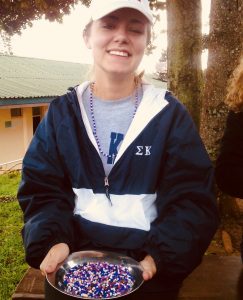 Paeten Denning holding a bowl of beads