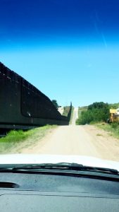 Wall and road at the Arizona-Mexico border