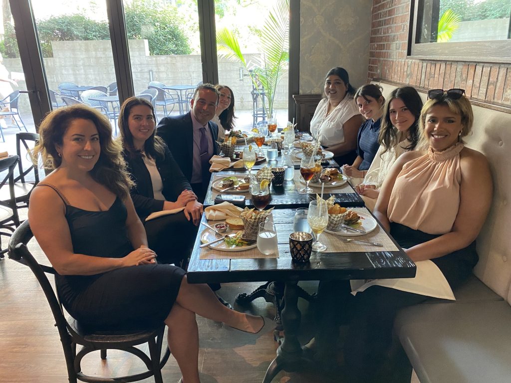a group of people seated at a table for a meal