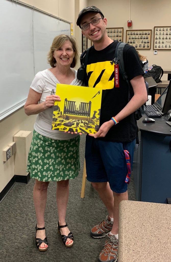 Long-time Metallica fan, Barnett poses with Prof. Laura Hines