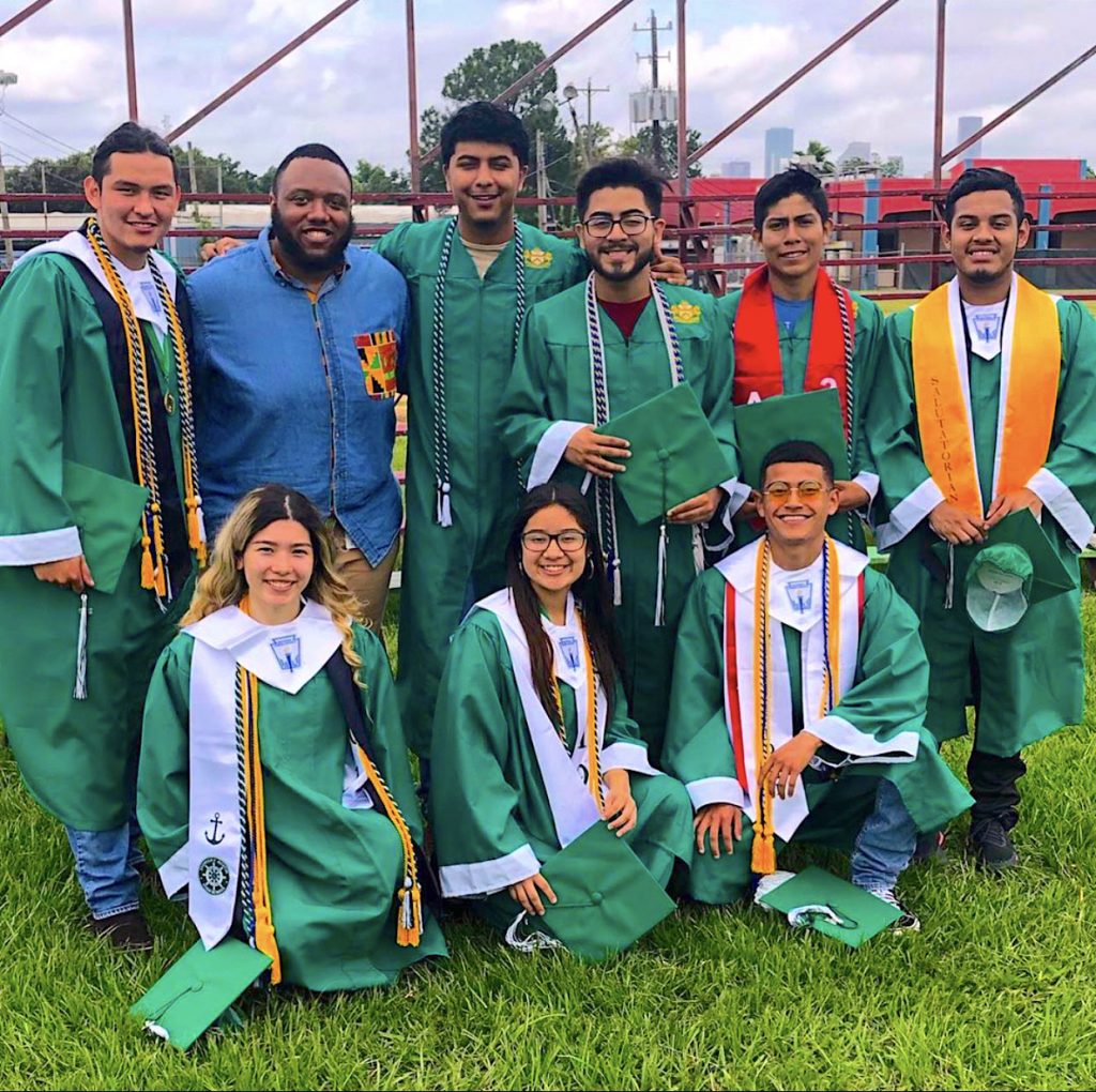 First-year law student Cortez Downey is pictured with some of his former students. Before coming to law school