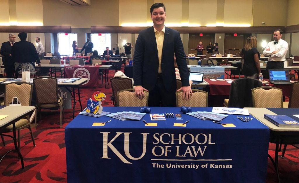 Ethan Brown at a recruiting table
