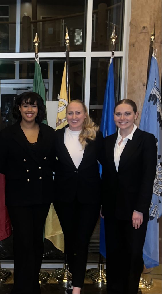 Three women standing together