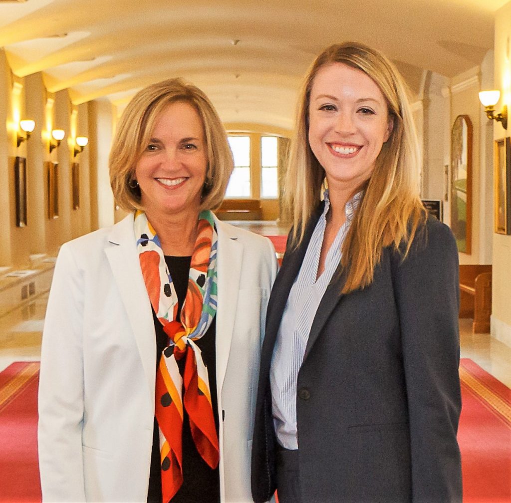 Sara Fevurly and Nancy Moritz posing in the hallway of a courthouse.