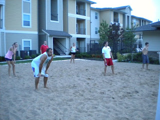 people playing sand volleyball