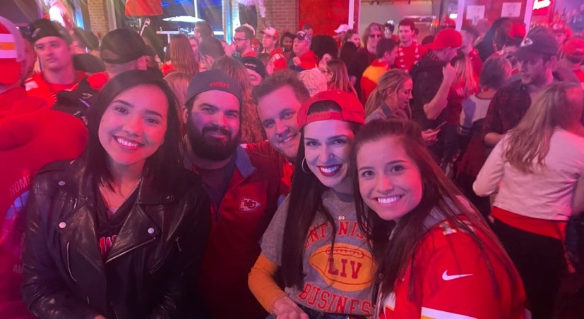 A group of law students in a crowd of people at the Kansas City Power & Light District.