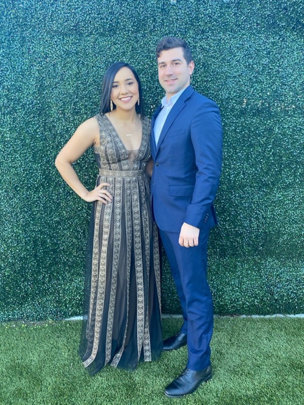 Valeria Carbajal and Ryan Gordon pose for a photo at a classmate's wedding