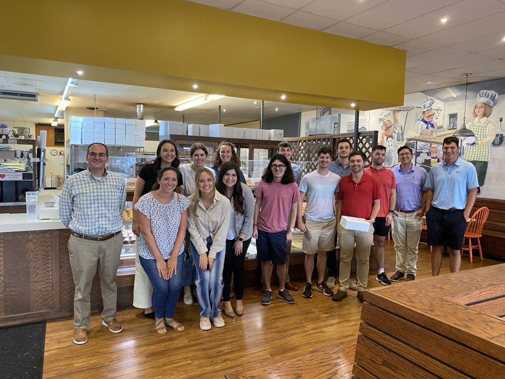 A Group of Students and Dean Mazza at Munchers Bakery