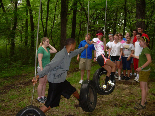 Students doing an activity on a ropes course