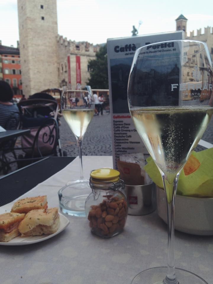 Meal with wine at outdoor cafe.
