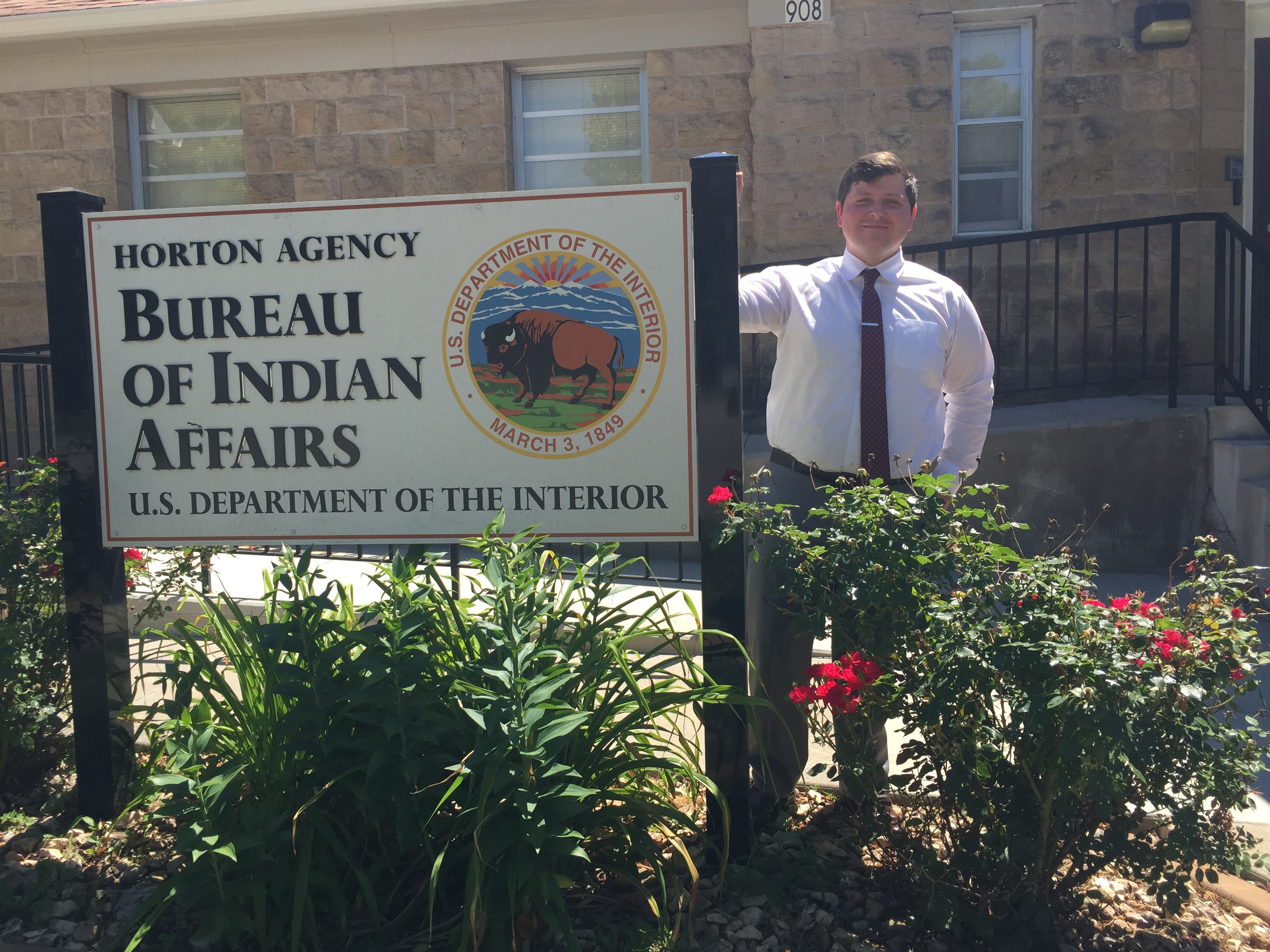 Ben Stringer with Bureau of Indian Affairs sign