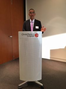 Bhala at lectern.