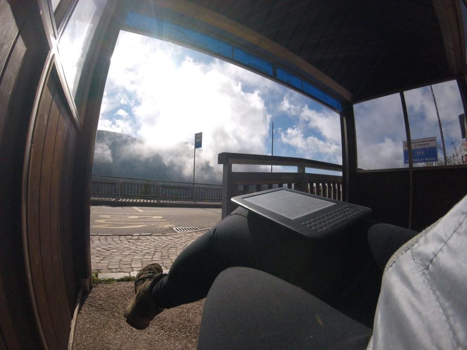 Bus stop with mountain views and clouds
