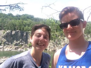 Malone and her girlfriend, Rachel Bunner, in front of trees and rock outcroppings.