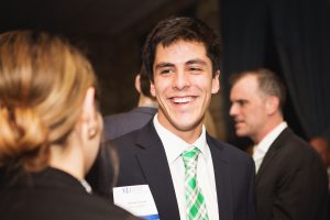Arturo Garcia talking with a peer