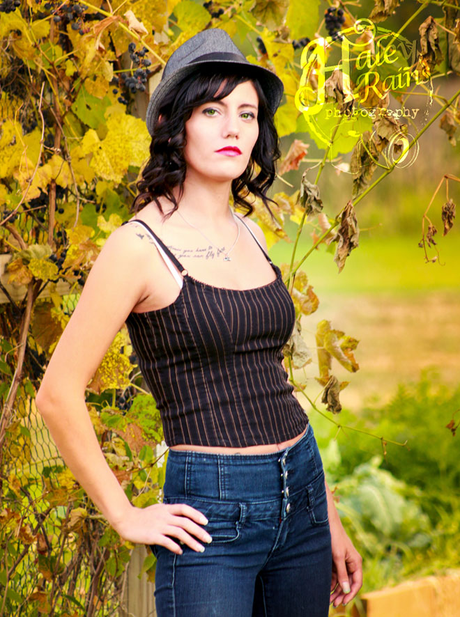 A woman posing for a photo with Haley Rains photography watermark in upper right corner