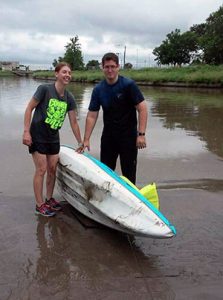 Joe Uhlman and his wife, Misti with kayak on edge of lake