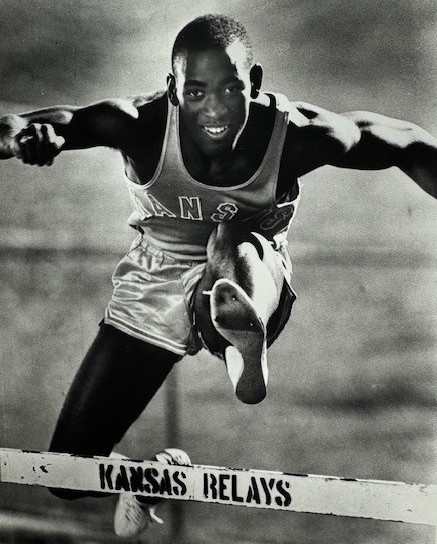 Kenneth Gaines jumping a hurdle.