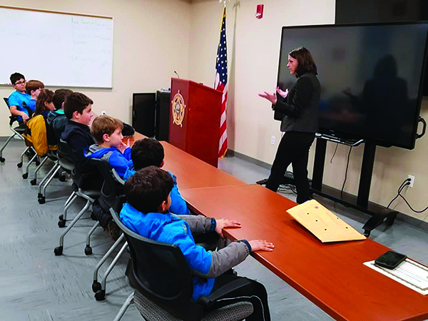 A classroom with students and a teacher