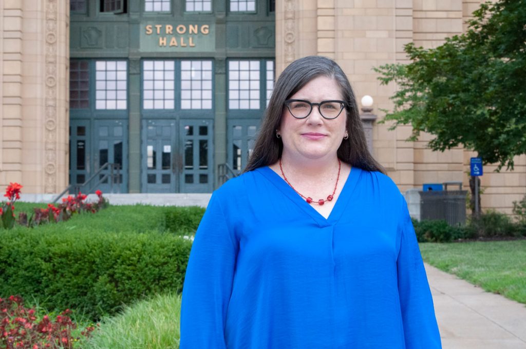 Sarah Deer in front of Strong Hall