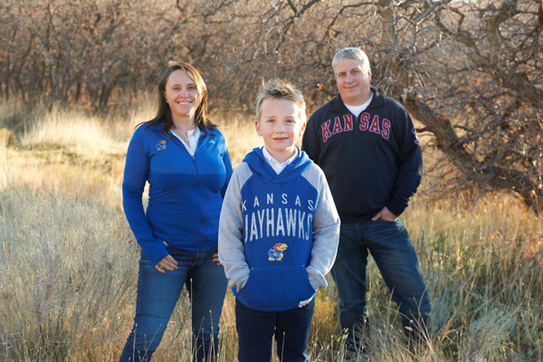 The Stowell family poses in KU gear