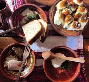 Bowls of Ukranian dishes and bread.