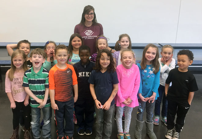 Sophia Dinkel with children at Boys & Girls Club of Lawrence.