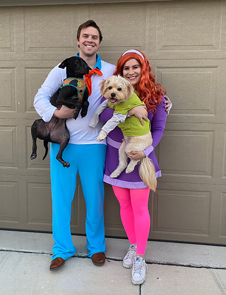Olivia Almirudis Schneider and her husband Aaron pose with their dogs Odin and Watson as the Scooby Doo gang